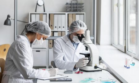 medium-shot-scientists-in-laboratory