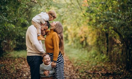 Young family with children in autumn park