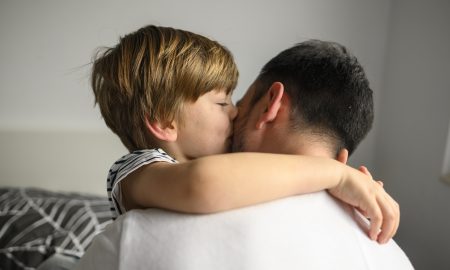 medium-shot-kid-hugging-his-father
