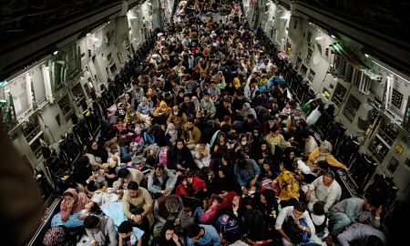 STYLELOCATIONHundreds of Afghan refugees sit on the floor of a U.S. Air Force C-17 Globemaster III aircraft, during the